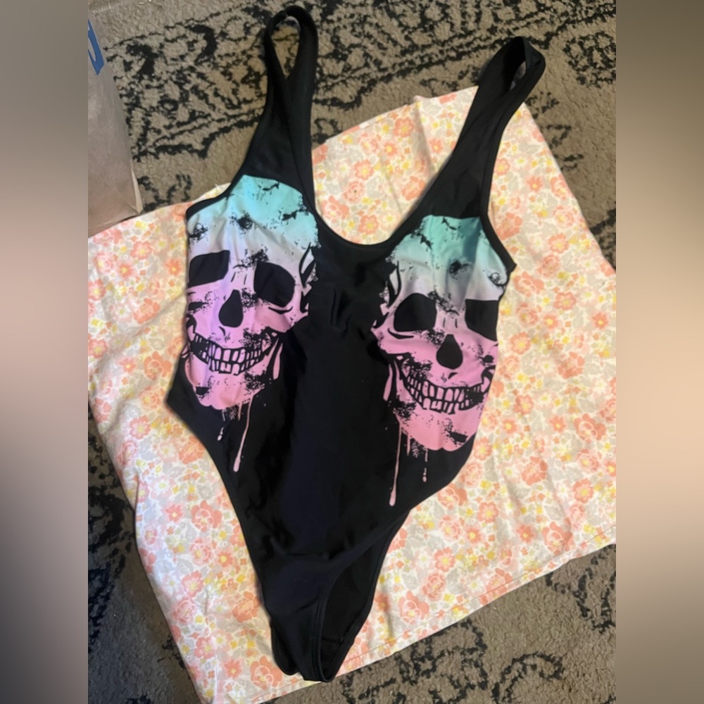Sexy, cheeky one piece bathing suit. Never worn, excellent condition!